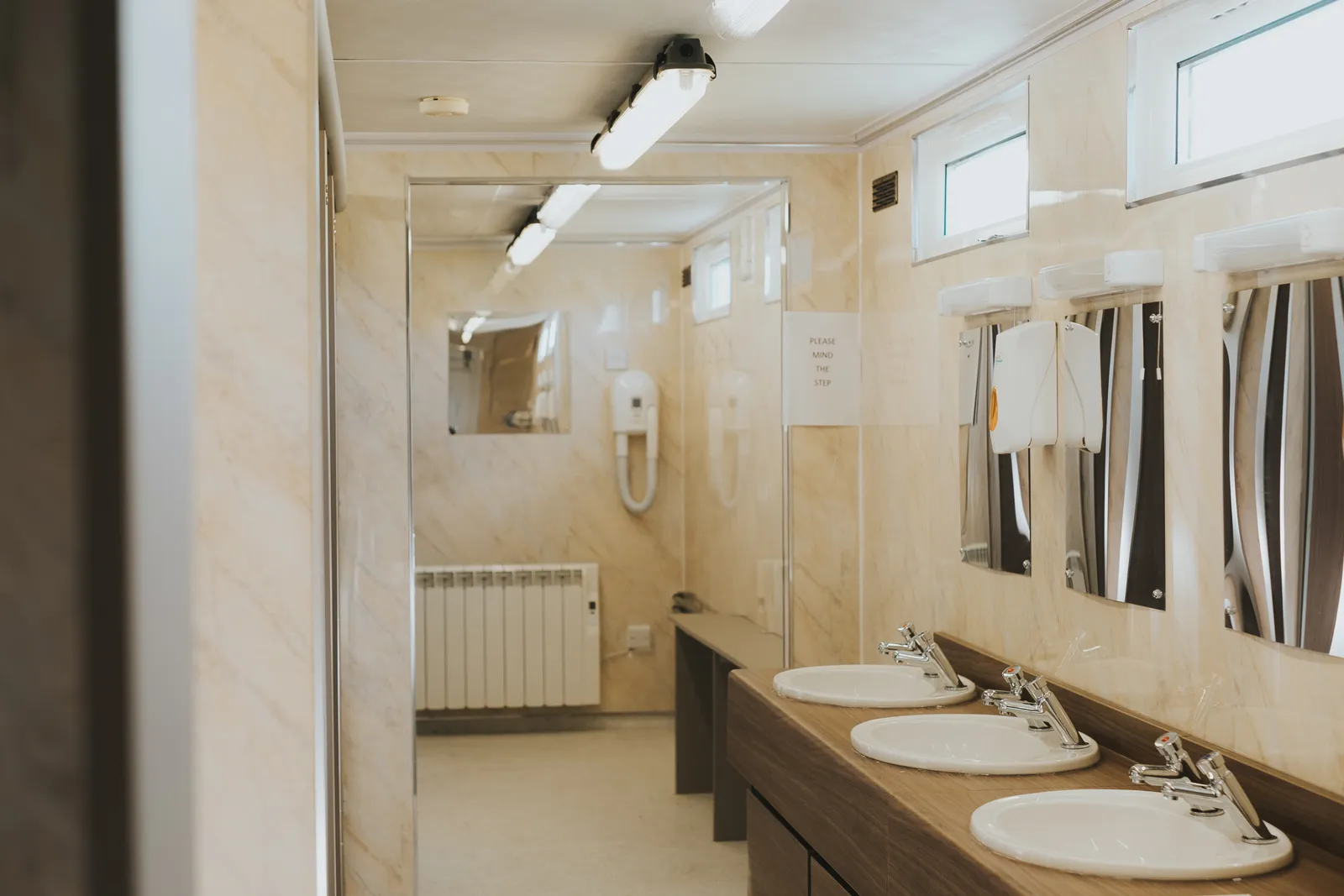 Heated toilet and shower block